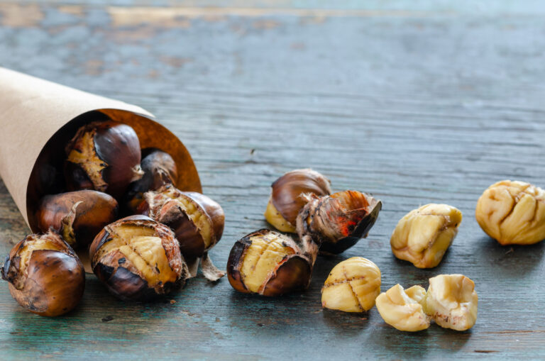 grilled chestnuts on the wooden table.
